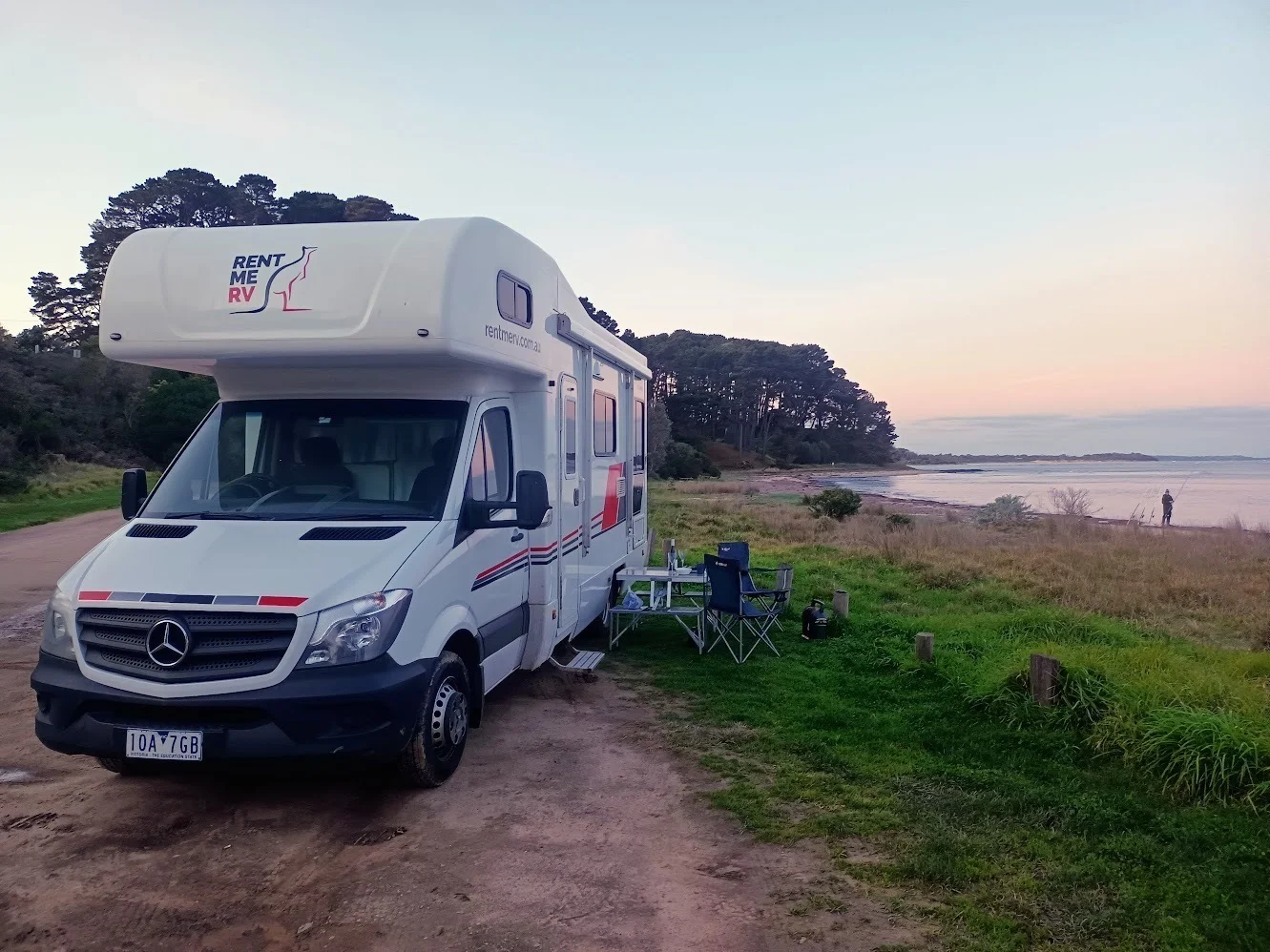 RentMeRV motorhome beside the coast at sunset